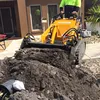 Mini skid loader chicken, cow dung cleaning machine