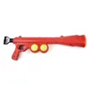 Shooting gun tennis launching ball interaction with pet puppy dog ball toy