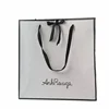 Beautiful stylish white paper bags for expensive clothes