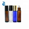 Wholesale empty essential oil perfume oil 5ml 6ml 8ml 10ml clear blue amber roll on glass bottle with steel roller ball