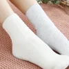Fashion solid color hot fluffy inner warm floor casual ladies tube socks