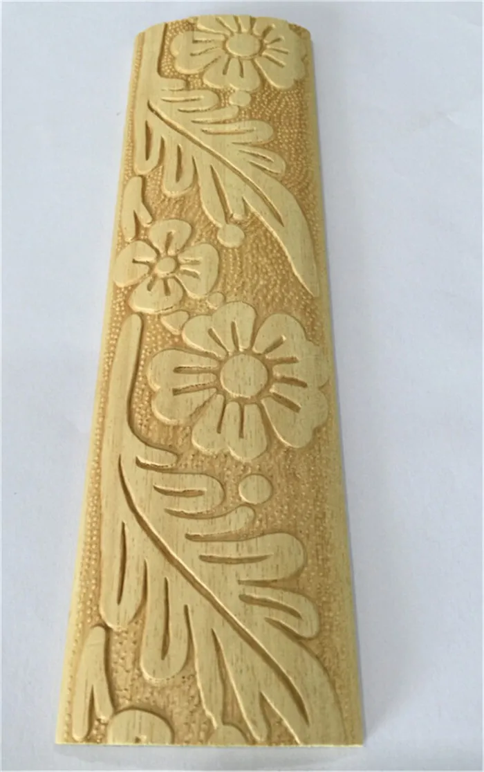 embossed white baseboard wood moulding