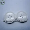 White resin/plastic button with four holes for lady's coat