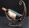 Best selling sea snail design one layer metal wine rack , European innovative metal crafts metal wire display rack wine holder