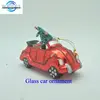Glass red racing car Christmas tree ornaments w/ mini Christmas tree on it