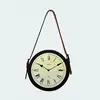 Metal wall mounted clock with belt