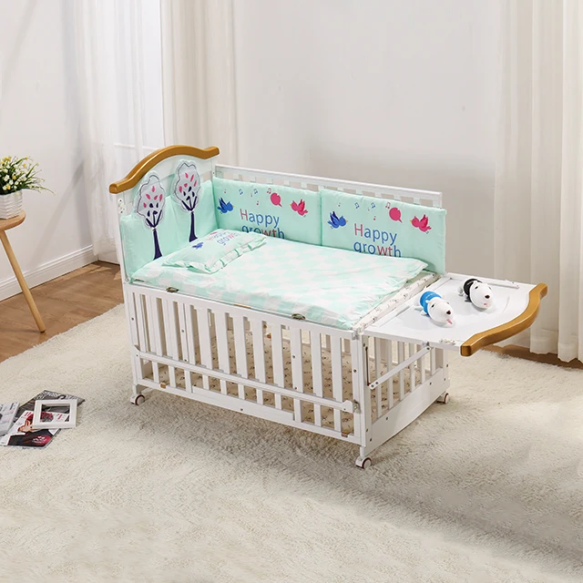 baby crib attached to bed