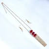 Long chain tassel necklace and earring set with marquise facet glass beads
