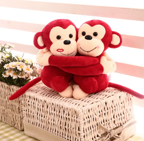 hugging stuffed monkeys