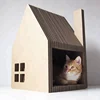 cat living and playing house cardboard with scratcher