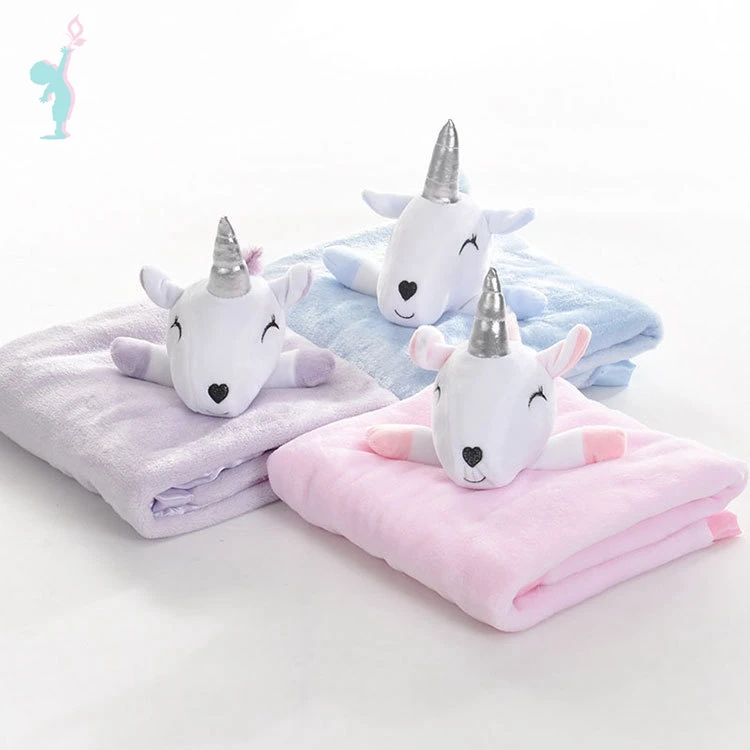 unicorn stuffed animal with blanket