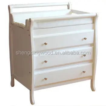 baby cot and changing table