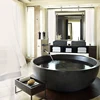 Hand-made natural stone round bathtub with clawfoot
