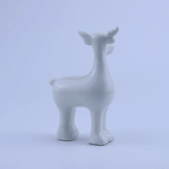 white ceramic reindeer figurine