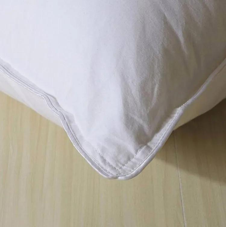 Wholesale five-star hotels full cotton feather silk cotton pillow core home sleep aid machine washable pillows supplier