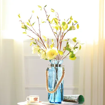 blue artificial flowers in vase