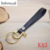factory direct embossed logo Personalized solid brass flat genuine Leather Keychain with ring and studs