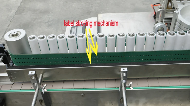 label stroking mechanism