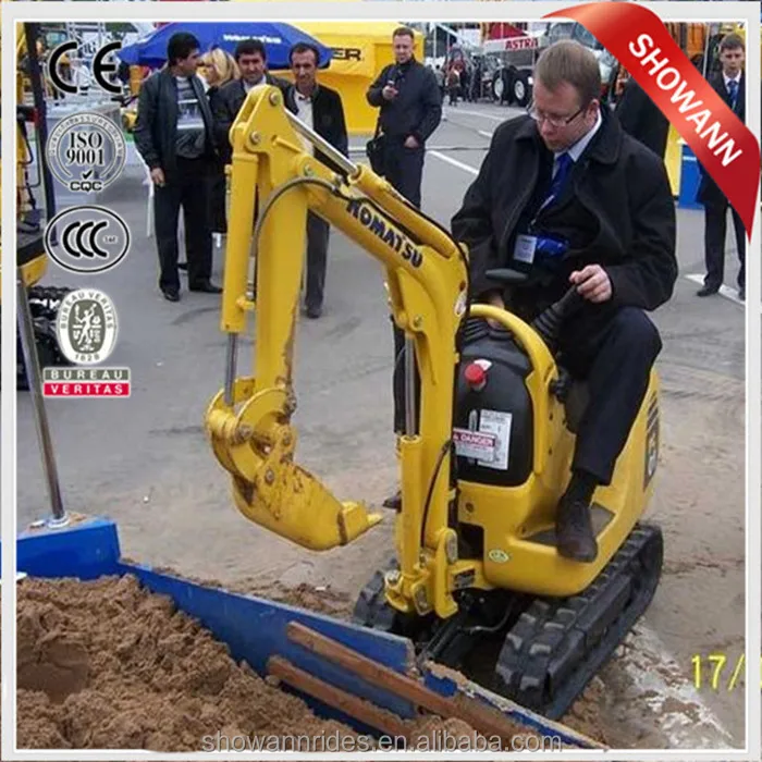 kids sit on excavator