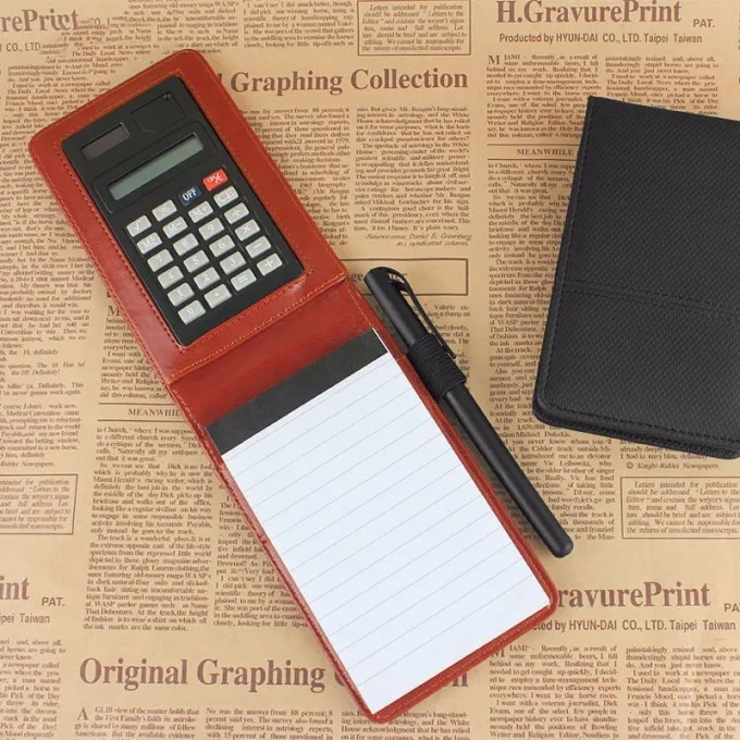 Small notepad with calculator and pen