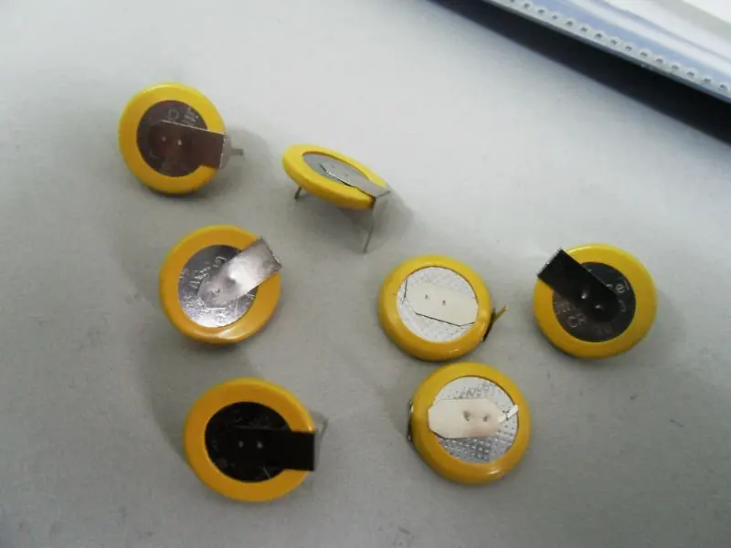 CR1220 battery with tabs