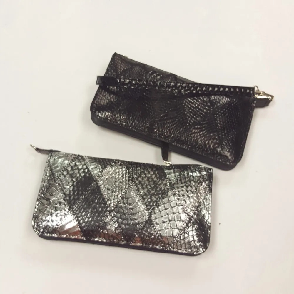 black and white snakeskin clutch bag