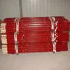 Red painted fence post for farm