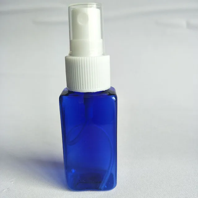 spraying hand sanitizer