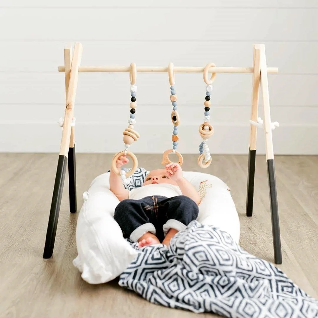 Foldable Baby Play Gym Frame Baby Exercise Activity Gym Hanging Bar Newborn Gift Baby Shower Gifts bopoobo Portable Baby Wood Gym Wood Play Gym with 3 Baby Teething Toys Pendant 