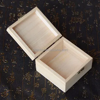 small wooden box with hinged lid