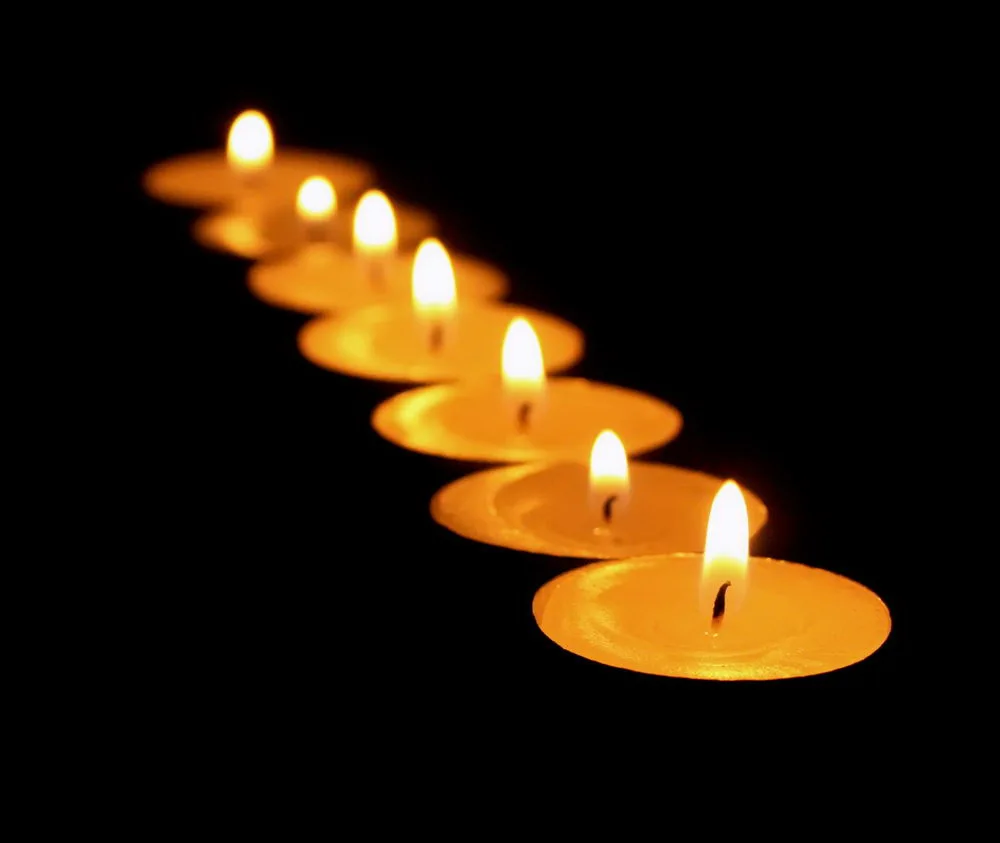 Формы горя. Candles on a Black background.