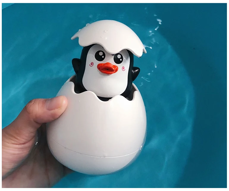 Plastic duck spray water game egg tub town toys penguin bath toy.jpg