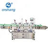 Automatic vertical positioning double head round bottle labeling machine
