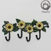 Antique cast iron flower shaped four hooks for garden decoration
