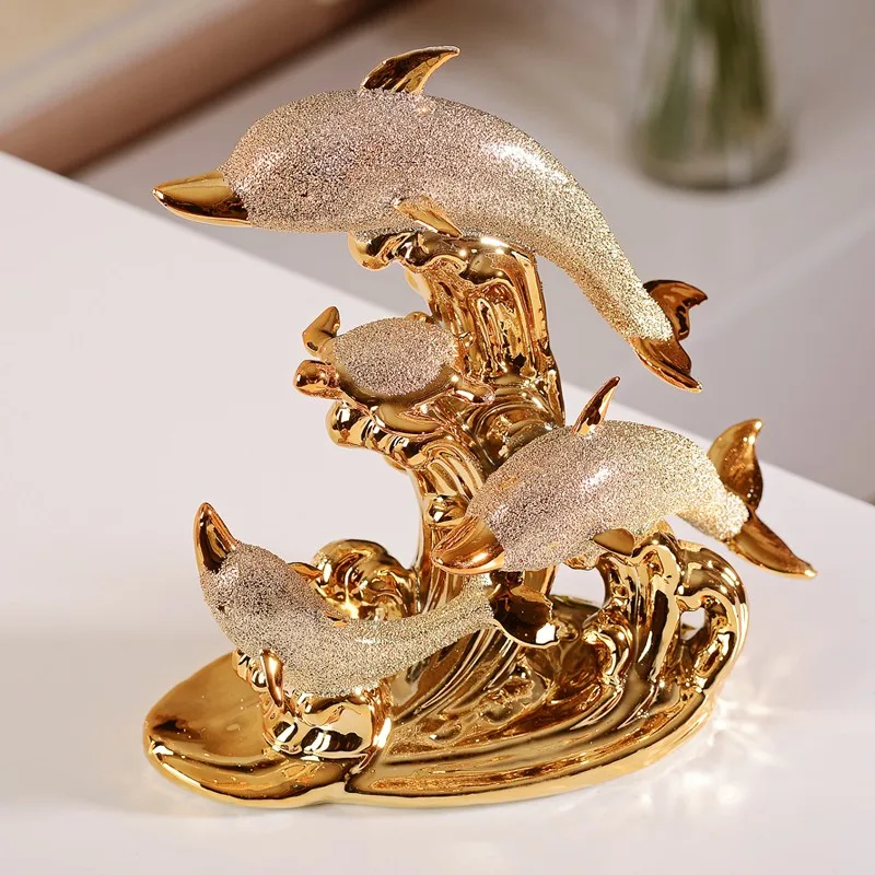 gold dolphin statues