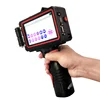 handheld industrial portable inkjet printer on wall