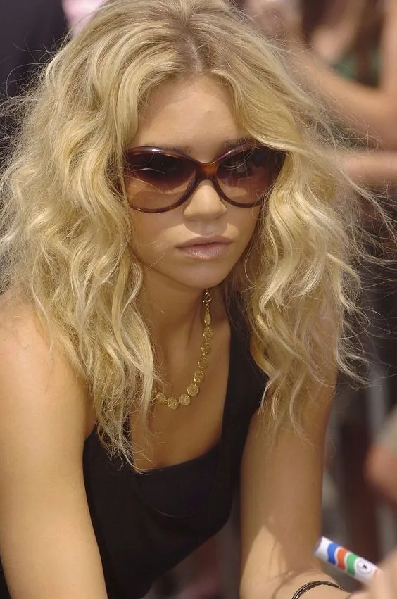 Skinny blonde messy curly