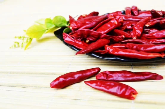 small round red hot fresh cherry chili peppers