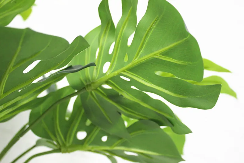 to your interior with this lifelike artificial monstera plant