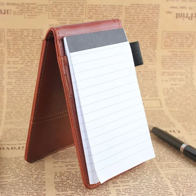 Small notepad with calculator and pen