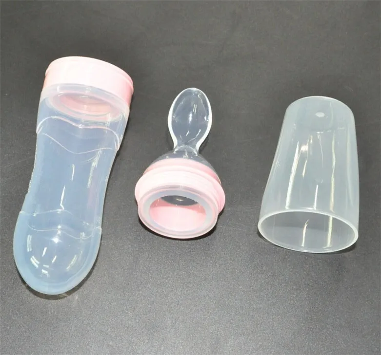 baby bottle with spoon attached
