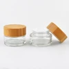 /product-detail/low-price-environmental-protection-5g-15g-30g-50g-100g-glass-jar-wooden-lid-cosmetic-for-skin-care-cream-packaging-62211672435.html