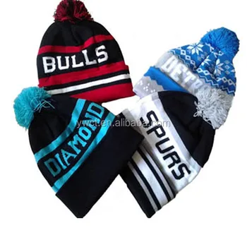 sports winter hats with ball on top