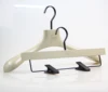 device in the shape of human shoulders casing hanger wooden hangers