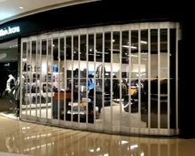 Commercial magasin de s&eacute;curit&eacute; en polycarbonate porte pliante en aluminium transparent en plastique coulissante accord&eacute;on portes d'obturation