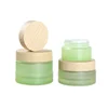 /product-detail/30ml-50ml-100ml-environmental-empty-bamboo-lid-glass-cream-jar-cosmetic-frosted-glass-container-and-wooden-lids-60775912679.html