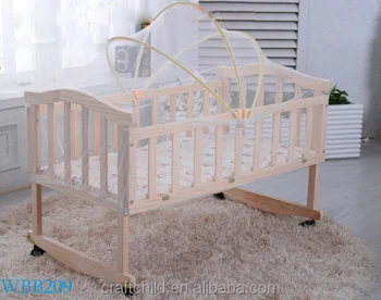 wooden travel cot