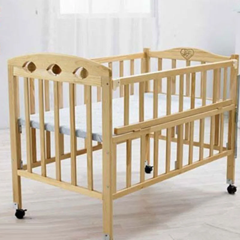 baby sleeping wooden bed