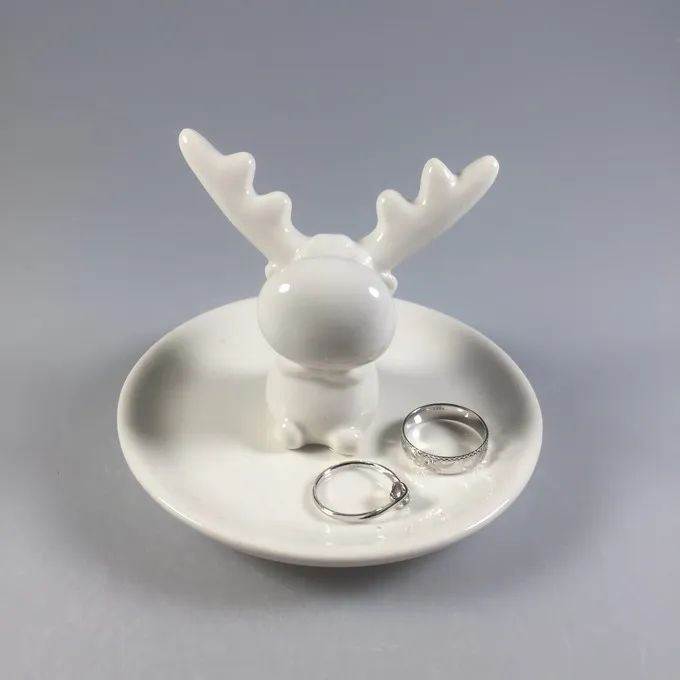 white ceramic reindeer figurine