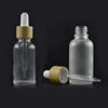 Round shape 5ml 10ml 15ml 20ml 30ml 50ml 100ml clear and frosted argan essential oil glass dropper bottle with bamboo cap